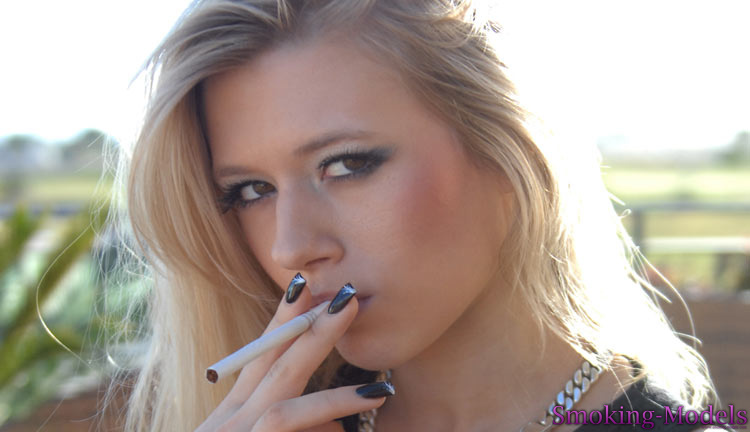 Michelle Moist smoking closeup